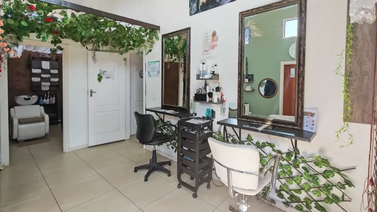 Hair styling stations with mirrors and salon chairs at Cedar Hair & Beauty