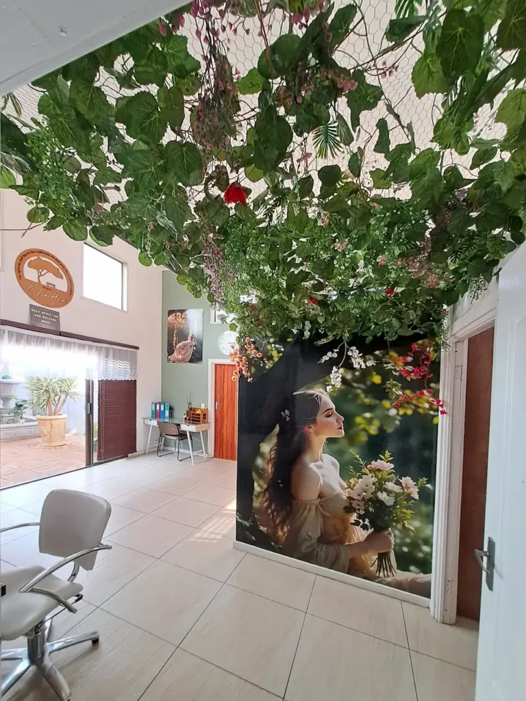 Interior of Cedar Hair & Beauty salon with decorative greenery
