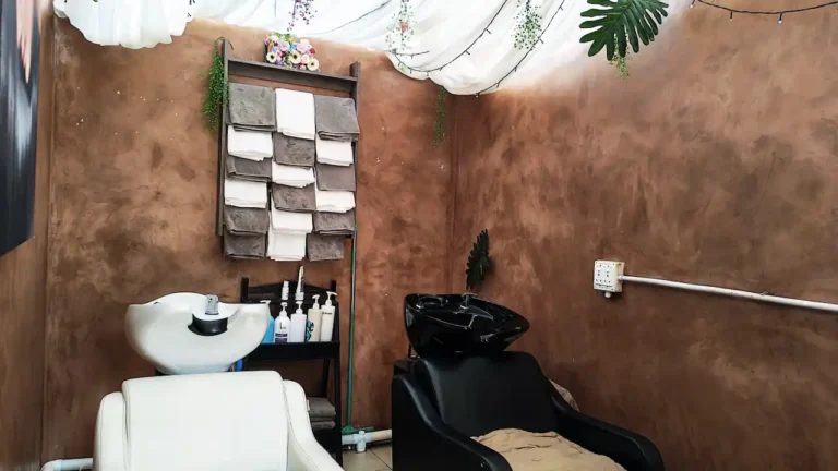 Hair washing area with salon wash basin and chair at Cedar Hair & Beauty